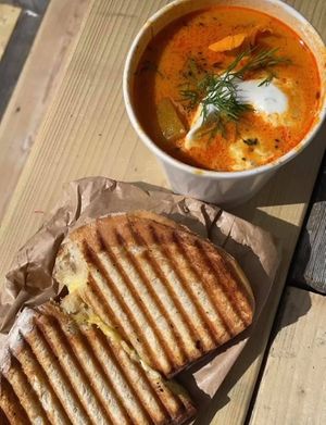 French saffron soup and vegan grilled cheese with carmilized onion at What'soup in Stockholm