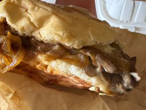 Benny’s cheesesteak burger (burger topped with steak, mushrooms, caramelized onions, jalapeños, mayo, and mozzarella) at Loving Hut - Mira Mesa in San Diego