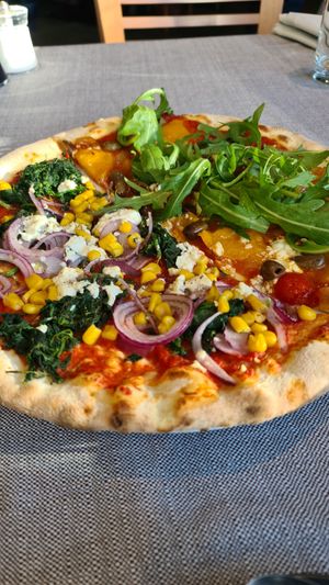 Both vegan pizzas cut in half at Lodenwirt in Obervintl