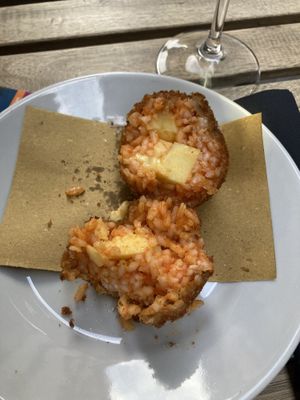 Supplí - fried rice balls with vegan cheese inside. Very delicious but a bit expensive (6€ + 2,50€ for service)  at Urbana 47 in Rome
