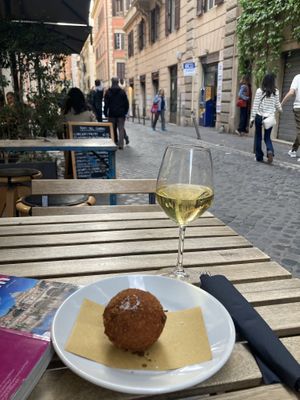 Good wine and very nice place to sit. Street with very nice and individual shops. Not too busy.   at Urbana 47 in Rome
