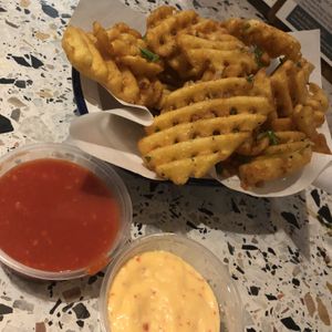 Vegan truffle waffle fries with vegan mayo and red sauce dips   at Square in Newcastle Upon Tyne