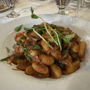 Potato Gnocchi with Mushrooms, Cherry Tomatoes, Shallots, Tomato Sauce and Arugula   at Aberfoyle Mill in Puslinch