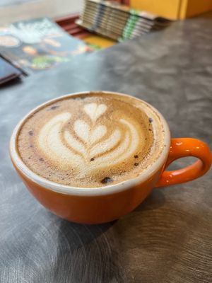 Vegan latte and vegan pumpkin muffin for breakfast. Only 2 vegan bakery options to choose from but it was good.  Nice staff. at Lemonjello's Coffee Shop in Holland