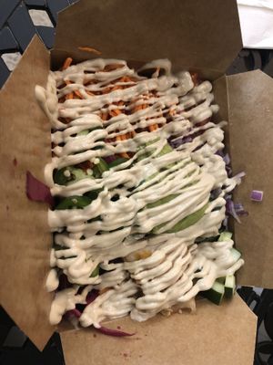 Pickled cabbage , nacho sauce, lettuce, tomato , guacamole , carrots , jalapeños, kimchi, onion   at Green Street Eatery in Levittown