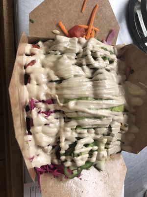 Pickled cabbage, nacho sauce , lettuce, tomato, guacamole, carrots, jalapeños, kimchi , onion   at Green Street Eatery in Levittown