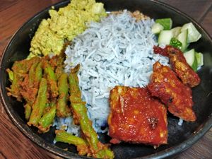Fairly Local - blue pea basmati rice, sambal tempeh, cucumber, curried long beans and scrambled tofu and crushed peanuts. at Ahimsa Sanctuary in Central Singapore