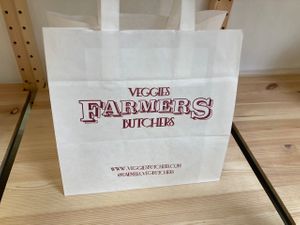 Website address at Farmers Veggies Butchers in Barcelona