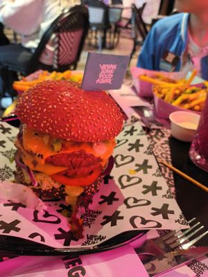 Mc Cruelty free double burger pink/ black bun at Vegan Junk Food Bar - Cologne in Cologne
