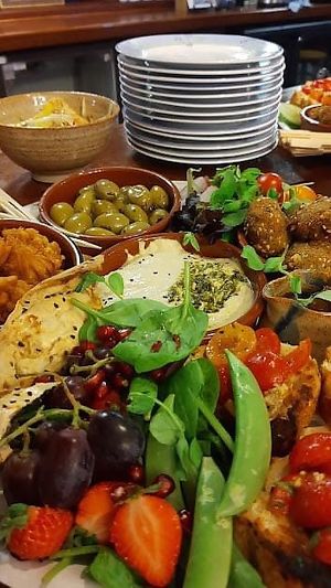 Huge Sharing Platter with, homemade falafel, hummus, toasted tortilla  bhaji, salt and pepper tofu, delicious fresh salad and mixed olives. at Bean Vegetarian & Vegan Cafe in Blackburn