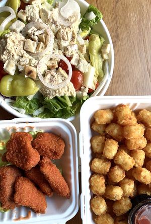 Greek salad, tots, and Buffalo nuggets!  at Plant Junkie Chicago in Chicago