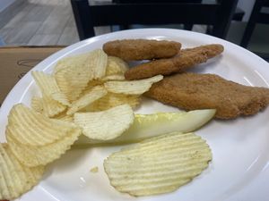 Chikn fingers (said it came with a bun but it came with chips?)  at Andes Variety & Take Out in Warren