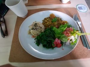 Lentil curry with couscous, salad and kale at Bancha in Portimao