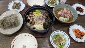 Boribap and lotus leaf rice plus side dishes at Memil Eondeok - 메밀언덕 in Seoul