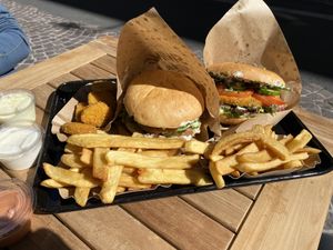 “Vienna Burger”…Schnitzel burger with garlic sauce and veggies along with fries and Golden Nuggets at Swing Kitchen in Innsbruck