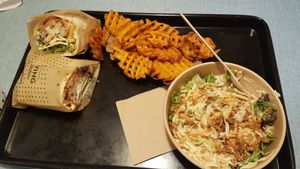 Wrap, cole slaw and sweet fries at Swing Kitchen in Innsbruck
