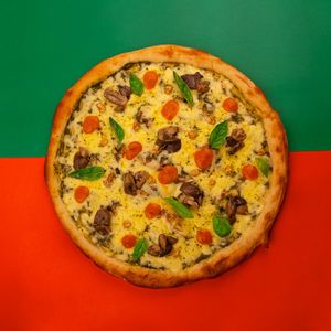 "Pizza Karü with pesto base, local artisan or vegan cheese, mushrooms, hints of pomodoro sauce, crunchy garbanzos and fresh basil. at Color Nativo in Puerto Varas