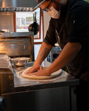 Our chef making his signature pizzas. at Color Nativo in Puerto Varas