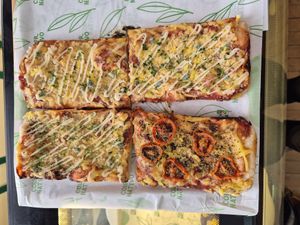 Vegan pizzas slices at Color Nativo in Puerto Varas