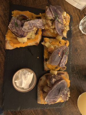 Potato pizza with (surely violife) cream cheese on the side   at Sonflour in Cork