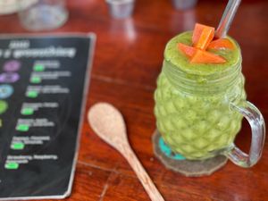 Customized smoothie with water, frozen banana, fresh papaya and spinach.  at 11:11 juices & smoothies  in Puerto Morelos