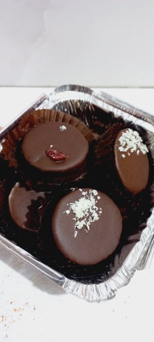 Alfajores relleno de manjar de Dátiles y bañados con chocolate al 70% at EkoSana - Postres Veganos in Lima