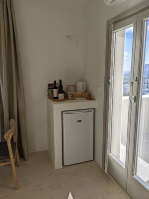 Corner of the Beta Suite with refrigerator at Mod Santorini in Santorini
