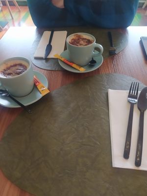 Table anda capuchino at Green Point in Aveiro