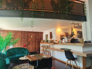 The waiting area, counter and selection of teas. at Green Point in Aveiro