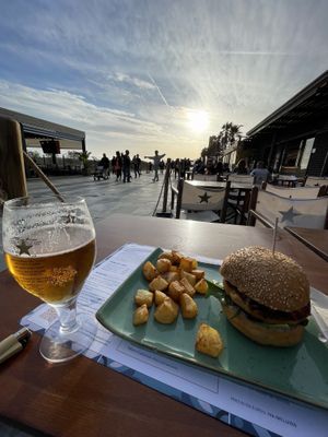 Vegan burger 10,20€ apr2023 + 1,80€ potatoes. Basil hummus, spinach, sundried tomatoes, crispy onions. Good burger😄had corn in it  at Ananda in Castelldefels