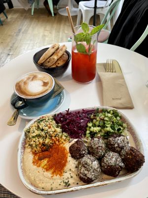 Heppy Vegan plate with raspberry/basil lemonade and an oat milk cappuccino   at Heppy Green in Frankfurt