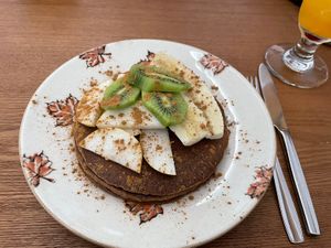 Pancakes with fruits and cinnamon   at Village Brunch & Coffee in Nazare