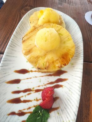 Piña asada con helado de maracuyá vegano at Terra in Javea