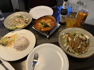 Red curry, rice noodles, and fried rice, plus Singha beer at Krua Siam in Akureyri