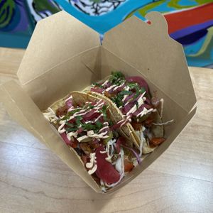 Peso Poutine with Pickled Onions, Pickled Jalapeños, and Cashew Crema  at 50 Pesos in Burlington