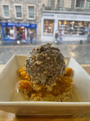 VEGAN HAGGIS - lentil "meat mixture" on top of mashed regular and sweet potatoes on a bed of whiskey and mustard gravy. at The Haggis Box in Edinburgh