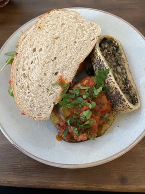 Squeaky bean sandwich, sausage roll, jacket potato  at The Bruce Arms in Ripon