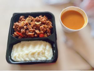 Orange glazed “meat” with mashed potatoes and lentil soup  at VegeMania by Chef Anthony Gomes in Belgrade