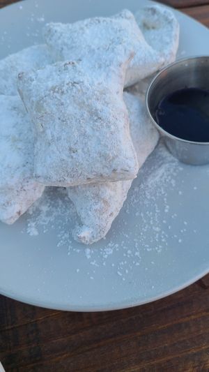 Beignets with raspberry coulis  at Picasso Cafe on Paseo in Oklahoma City