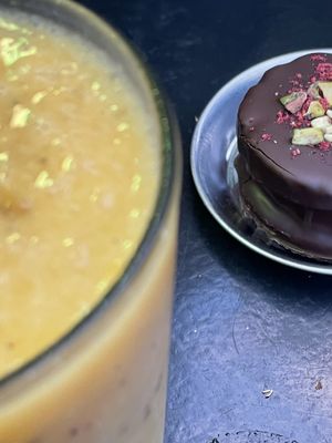 Mango - passion fruit smoothie and alfajor  at Fifi Almacén in Buenos Aires