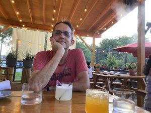 Covered patio with lights and misting fans  at Llama Queen in Austin