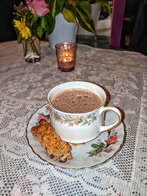 hot chocolate and mandlbroyt at Pink Peacock די ראָזעווע פּאַווע in Glasgow