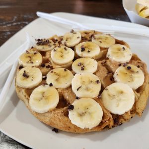 Peanut Butter Waffle with Banana and Cacao chips! at Pure Vegan Cafe in Raleigh