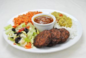 Kofta set: Carrots-cabagge cutlets (3 pcs), Tomato sauce, Basmati rice, raw veggie salad.  at Najadacze.pl - Vege Kuchnia Swiata in Wroclaw