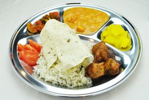 Thali XXL set: Basmati rice, Sabji, Coconut Curry Tofu, Sweet & Spicy Fruit Chutney, Papadam, Pakoras, Tomato  at Najadacze.pl - Vege Kuchnia Swiata in Wroclaw