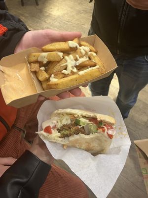 Falafel pita with fries (vegan spicy mayonnaise)  at Maoz - Damrak in Amsterdam