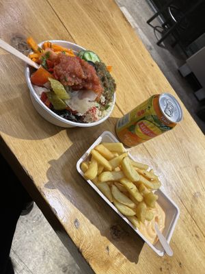 Salad bowl, fries, and drink  at Maoz - Damrak in Amsterdam