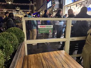 Signage   at Maoz - Damrak in Amsterdam