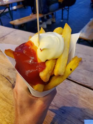 Vegan Fries with ketchup and mayo at Maoz - Damrak in Amsterdam