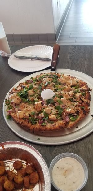 Vegan Tikka Masala Pizza. Crispy light crust, Indian flavors, fresh veggies, and creamy sauce! at Pizza Twist in Bakersfield